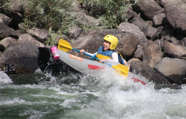 single kayak in a rapid